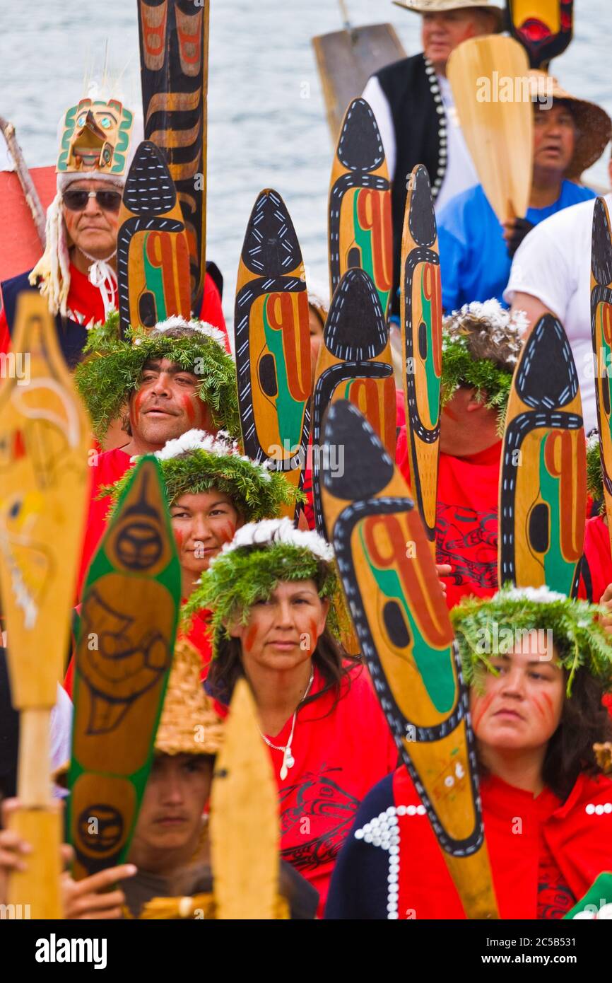 Indigenous tribal members arriving by canoe to attend a major cultural