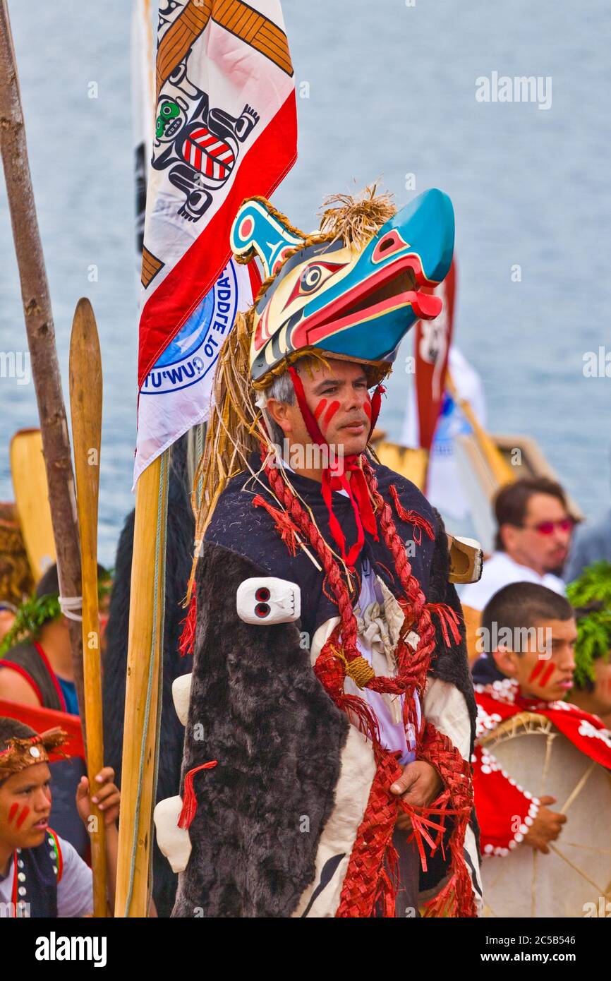 Indigenous tribal members arriving by canoe to attend a major cultural