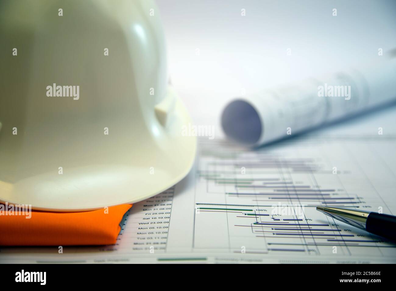 Construction project planning, management concept, gantt chart schedule, blueprints, helmet, calculator different management tools Stock Photo