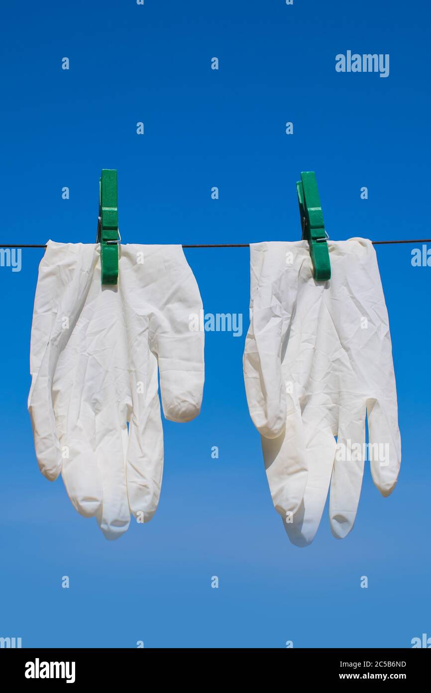 protective gloves dried on sunlight after washing and disinfection