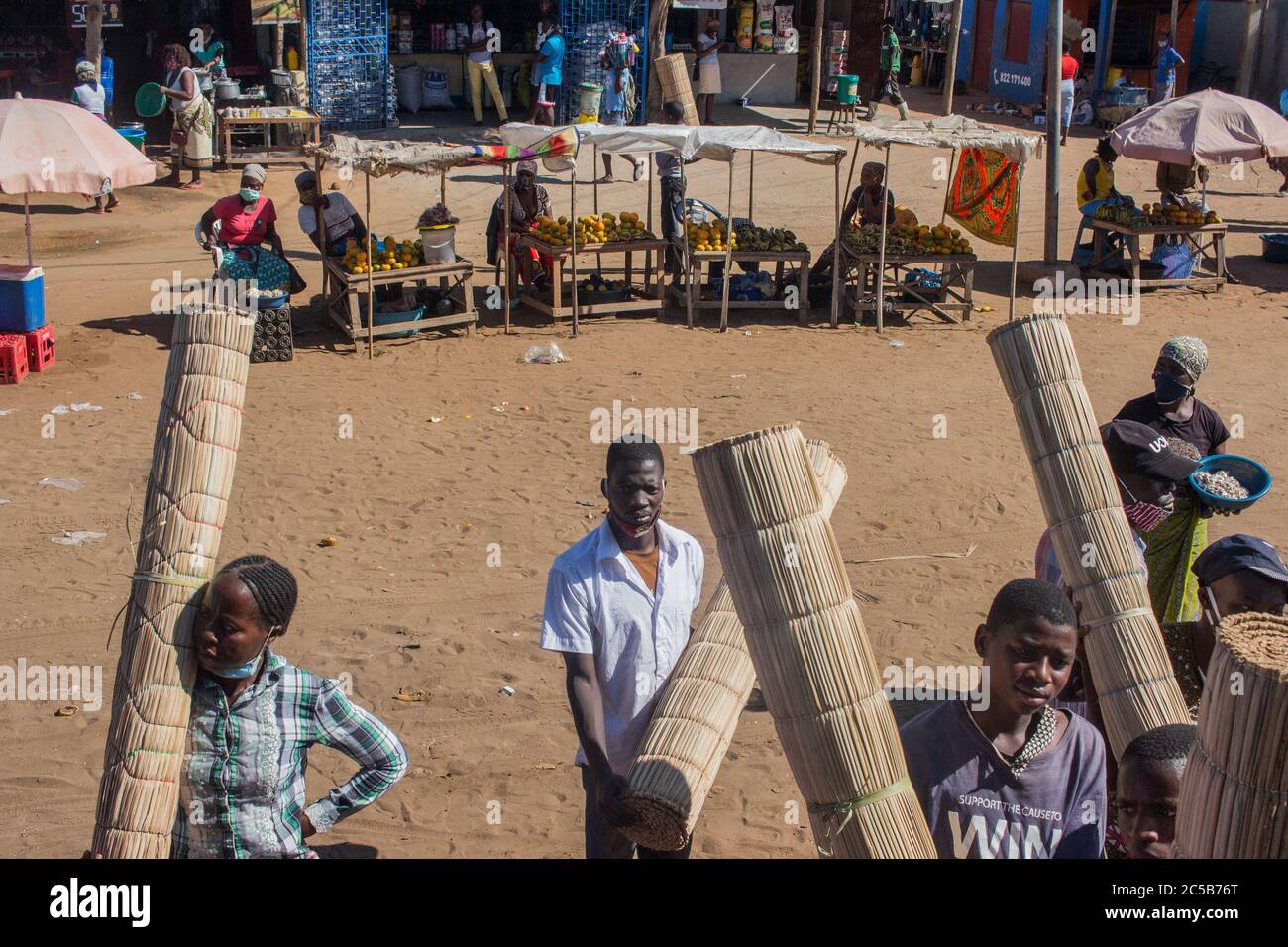 Street vendors selling handmade woven mats in the market in Inhambane Province, Mozambique Stock Photo