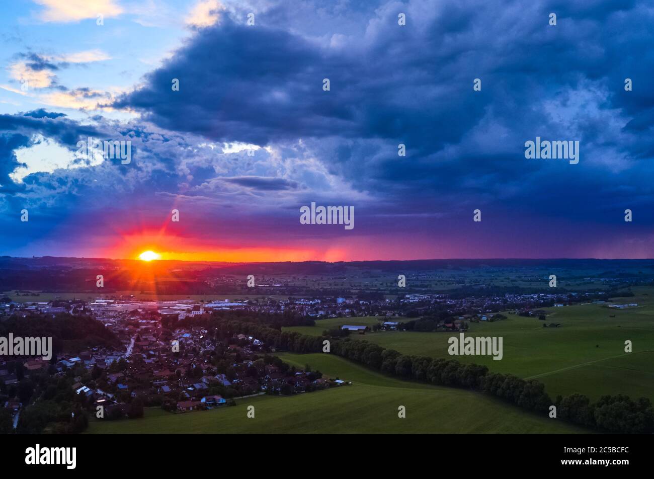 Marktoberdorf, Germany, July 01, 2020.  Stormy weather with heavy rain changes with sunset and rainbow. Aerial drone image Mavic 2 pro. © Peter Schatz / Alamy Stock Photos Stock Photo