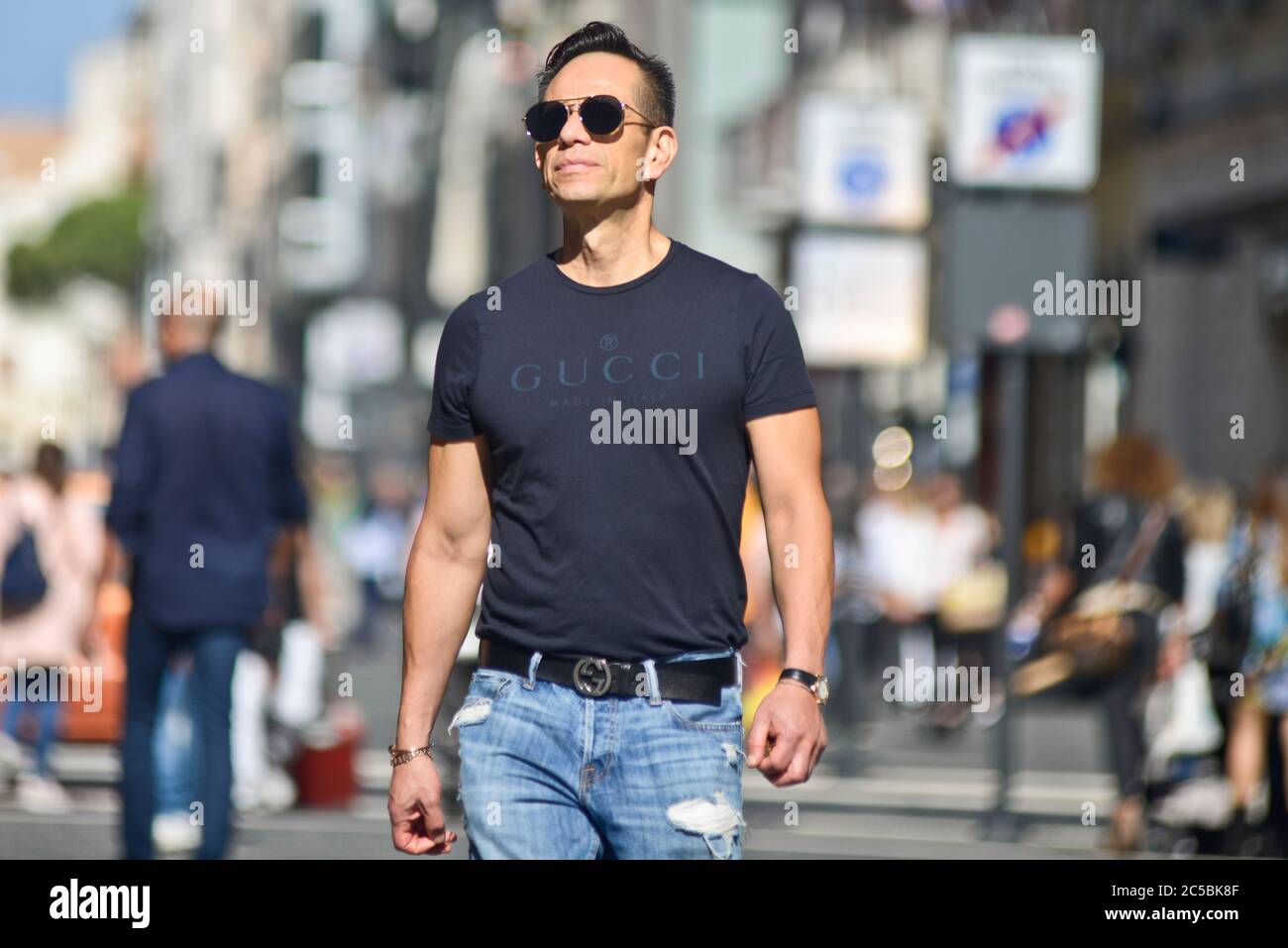 Italian man wearing a Gucci t-shirt in Via Sparano da Bari. Bari, Italy  Stock Photo - Alamy
