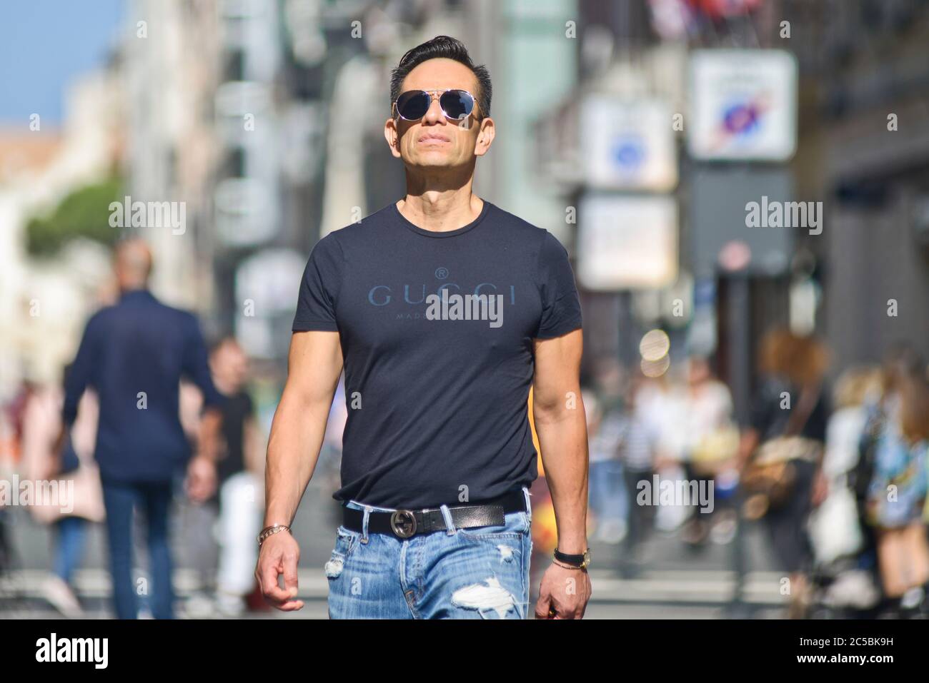 Italian man wearing a Gucci t-shirt in Via Sparano da Bari. Bari, Italy Stock Photo