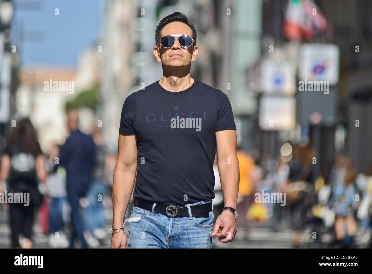 Italian man wearing a Gucci t-shirt in Via Sparano da Bari. Bari, Italy  Stock Photo - Alamy