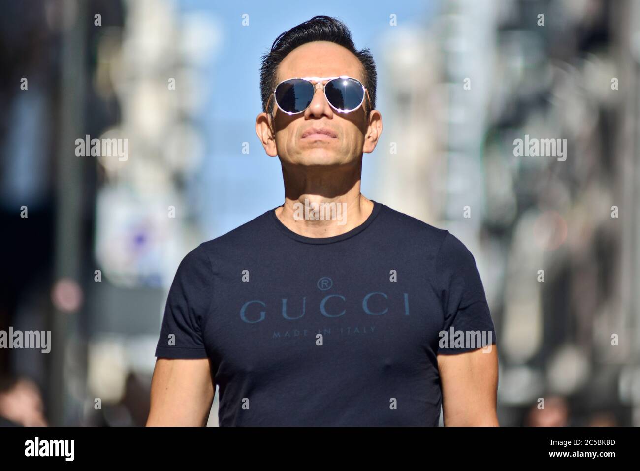 Italian man wearing a Gucci t-shirt in Via Sparano da Bari. Bari, Italy Stock Photo