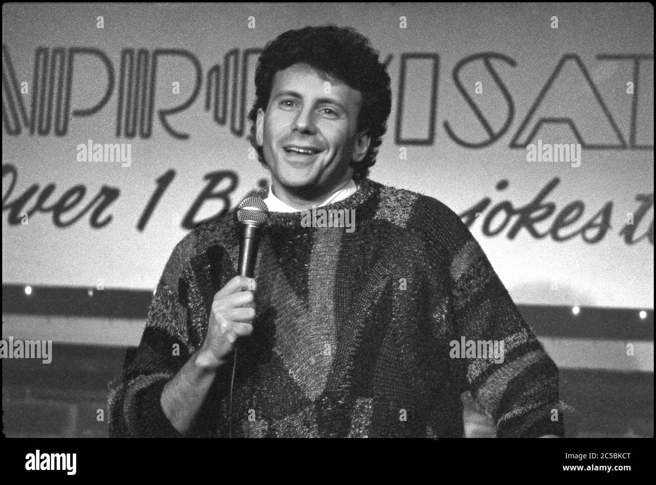 Comedian Paul Reiser performing stand up comedy at the Improv Theater in Werst Hollywood, CA circa 1980s Stock Photo