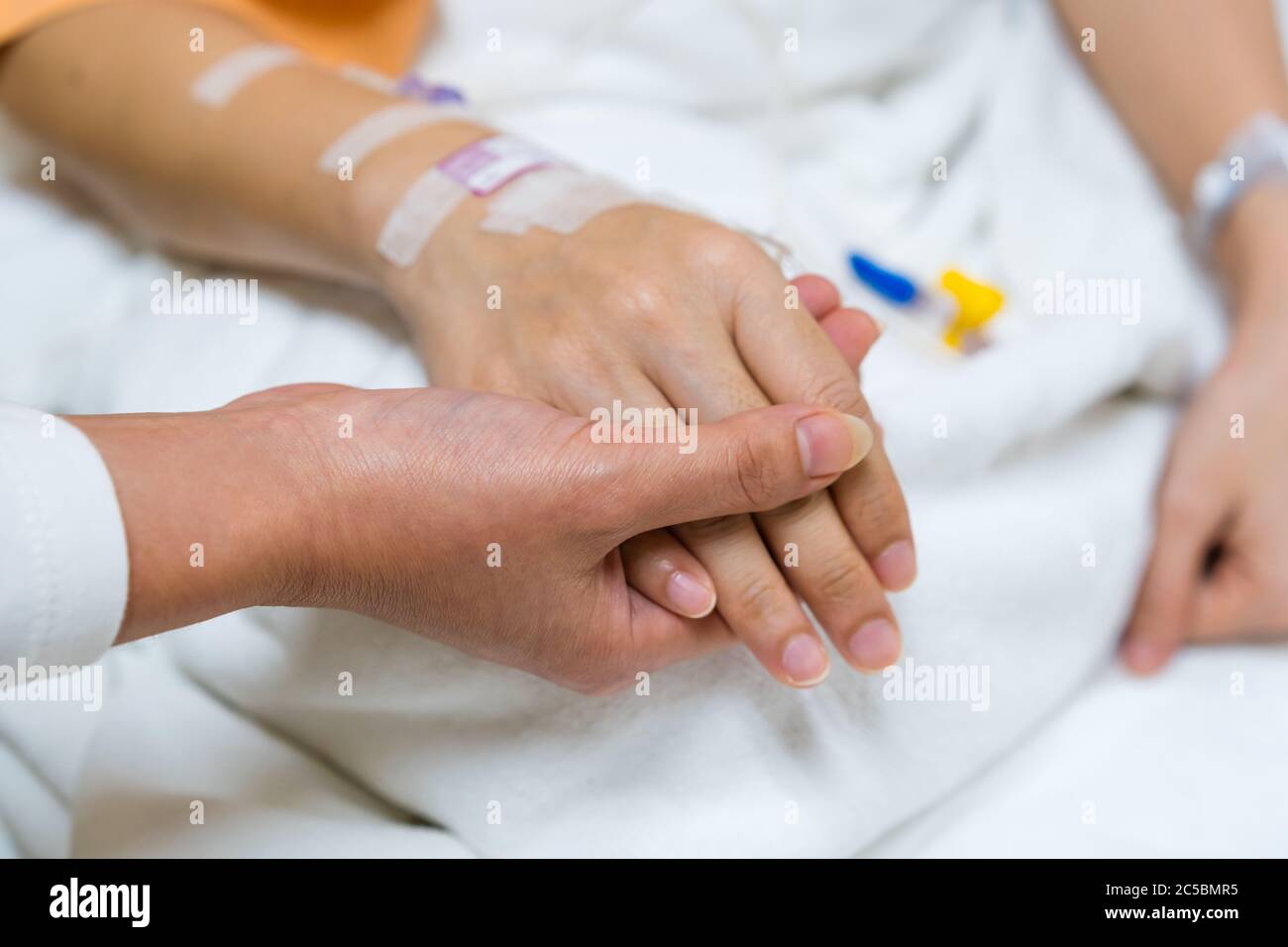 Elderly patient hand doctor bed hires stock photography and images Alamy