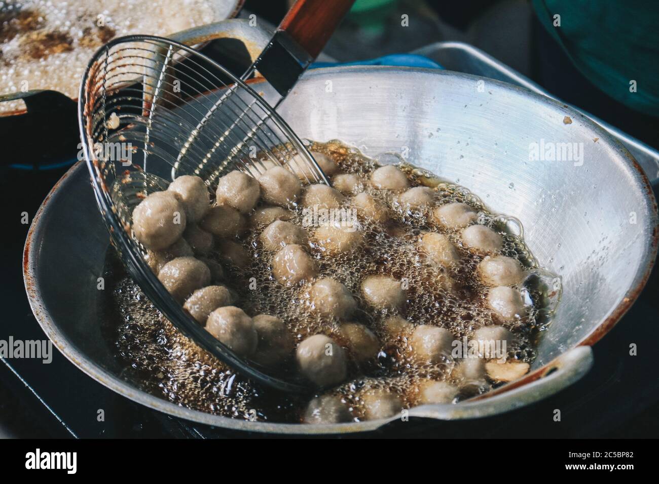 Cooking meatballs in the boiling oil in frying pan Stock Photo Alamy