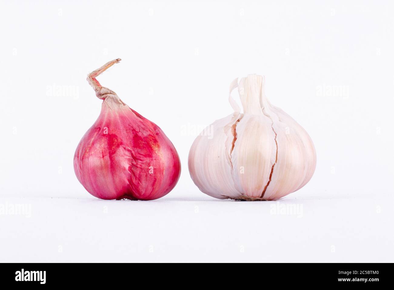 Shallots (Red Onion) and Garlics are popular ingredients in cooking. Stock Photo