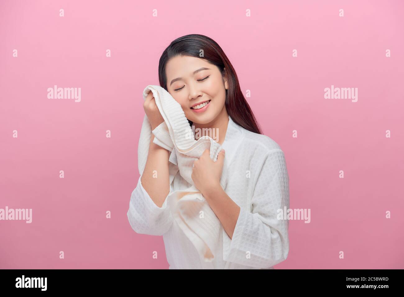 Woman enjoying the softness of a towel Stock Photo