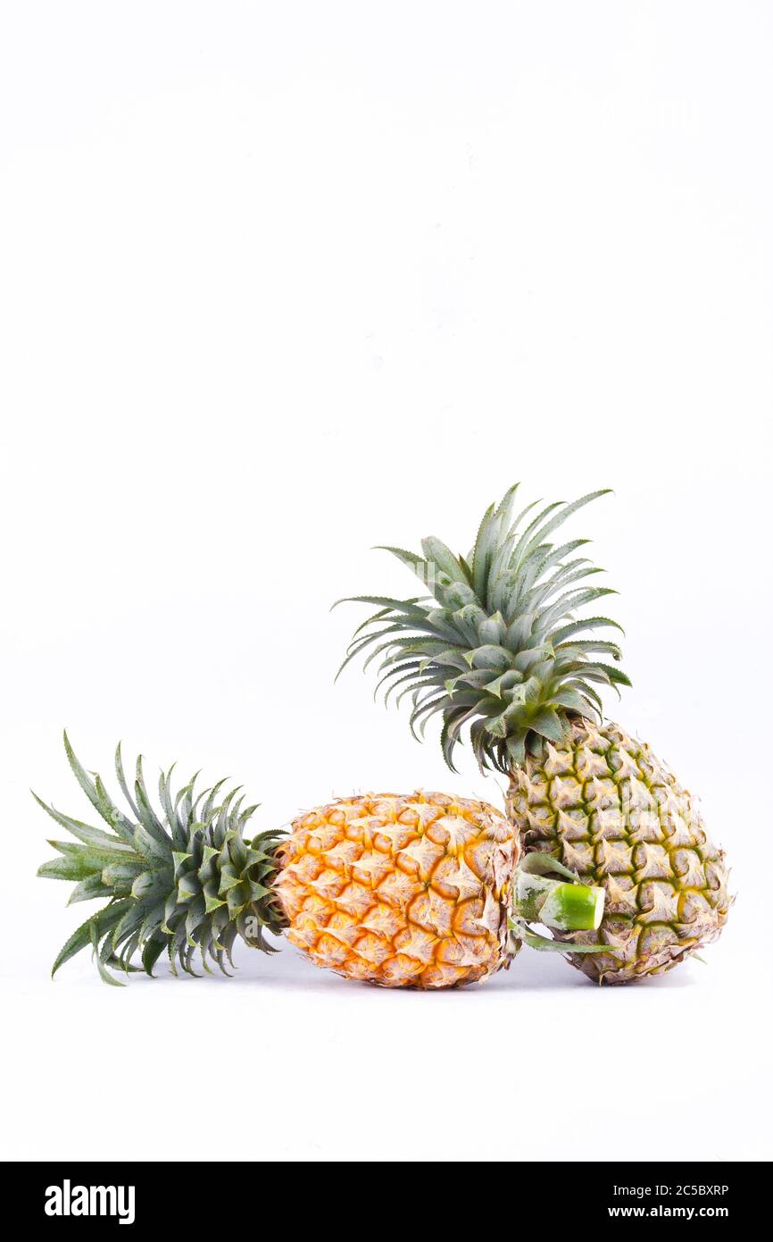 couple ripe pineapple on white background healthy pineapple fruit food isolated Stock Photo