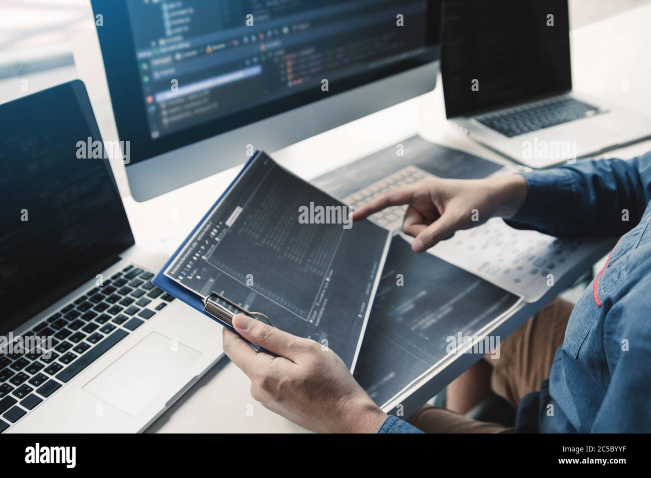 Asian man working code program developer computer web development working design software on desk in office. Stock Photo