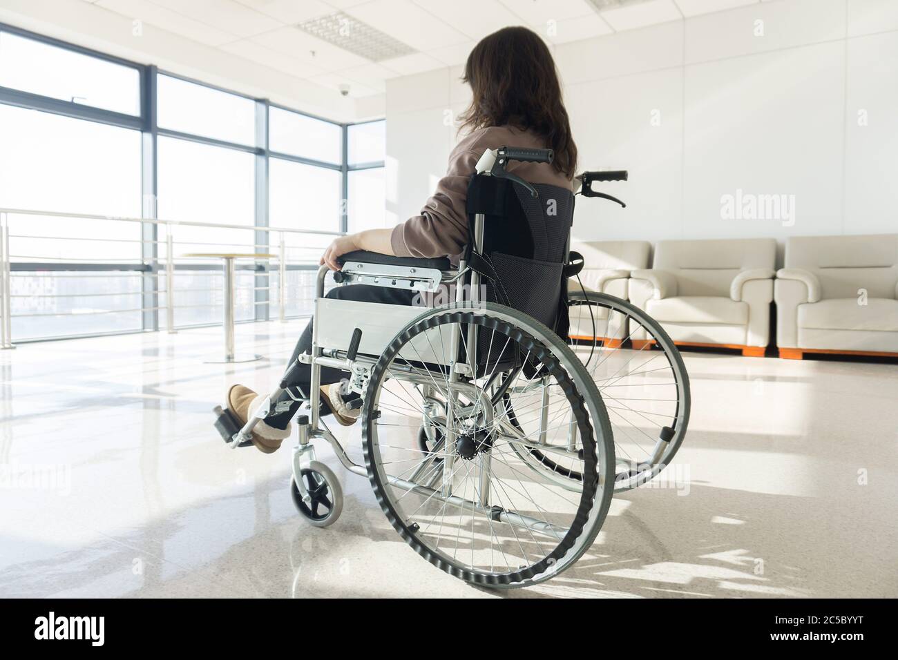 Japanese young woman sitting in a wheelchair Stock Photo Alamy