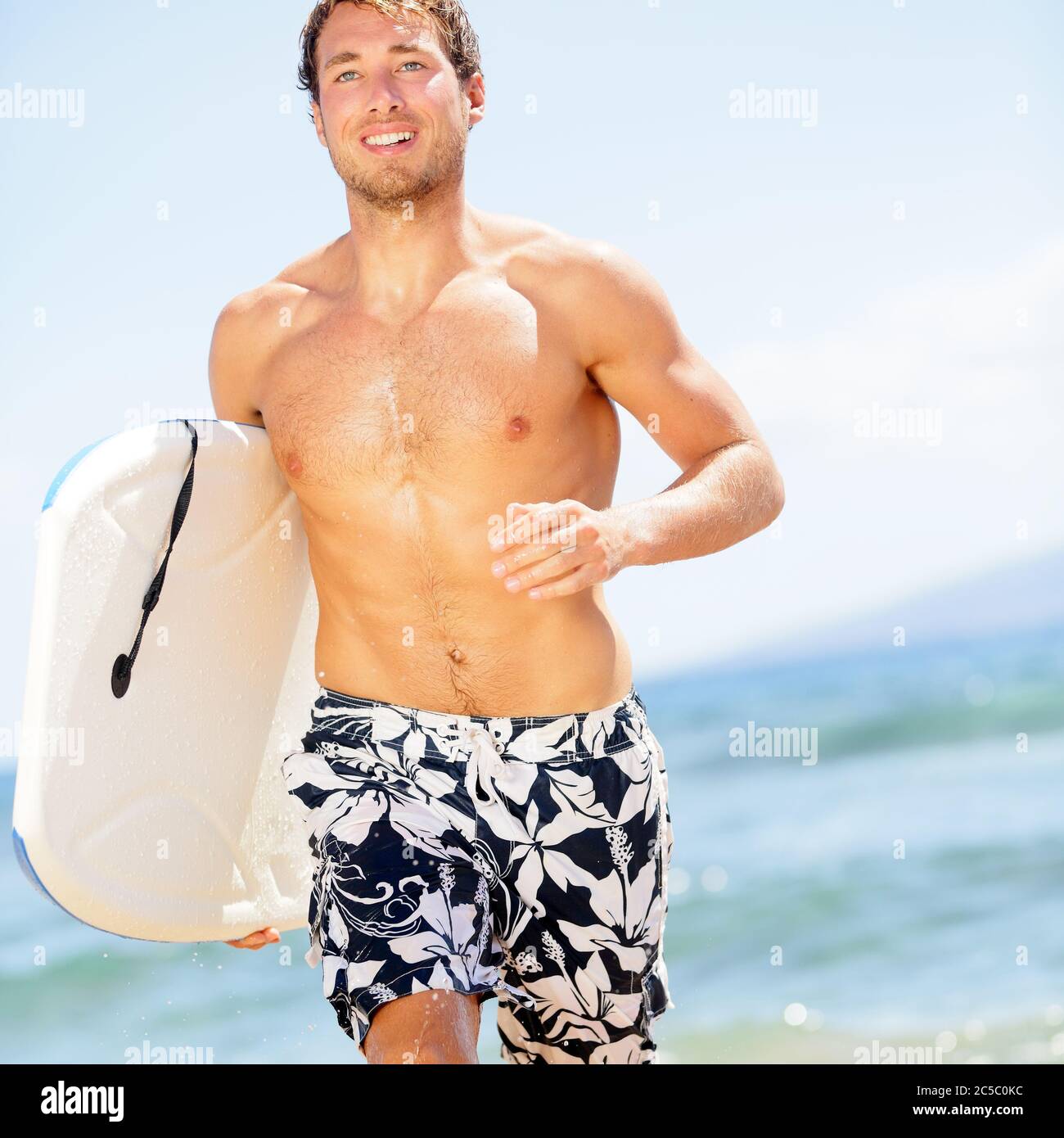 Handsome man surfer fun on summer beach. bodyboarding surfing good ...