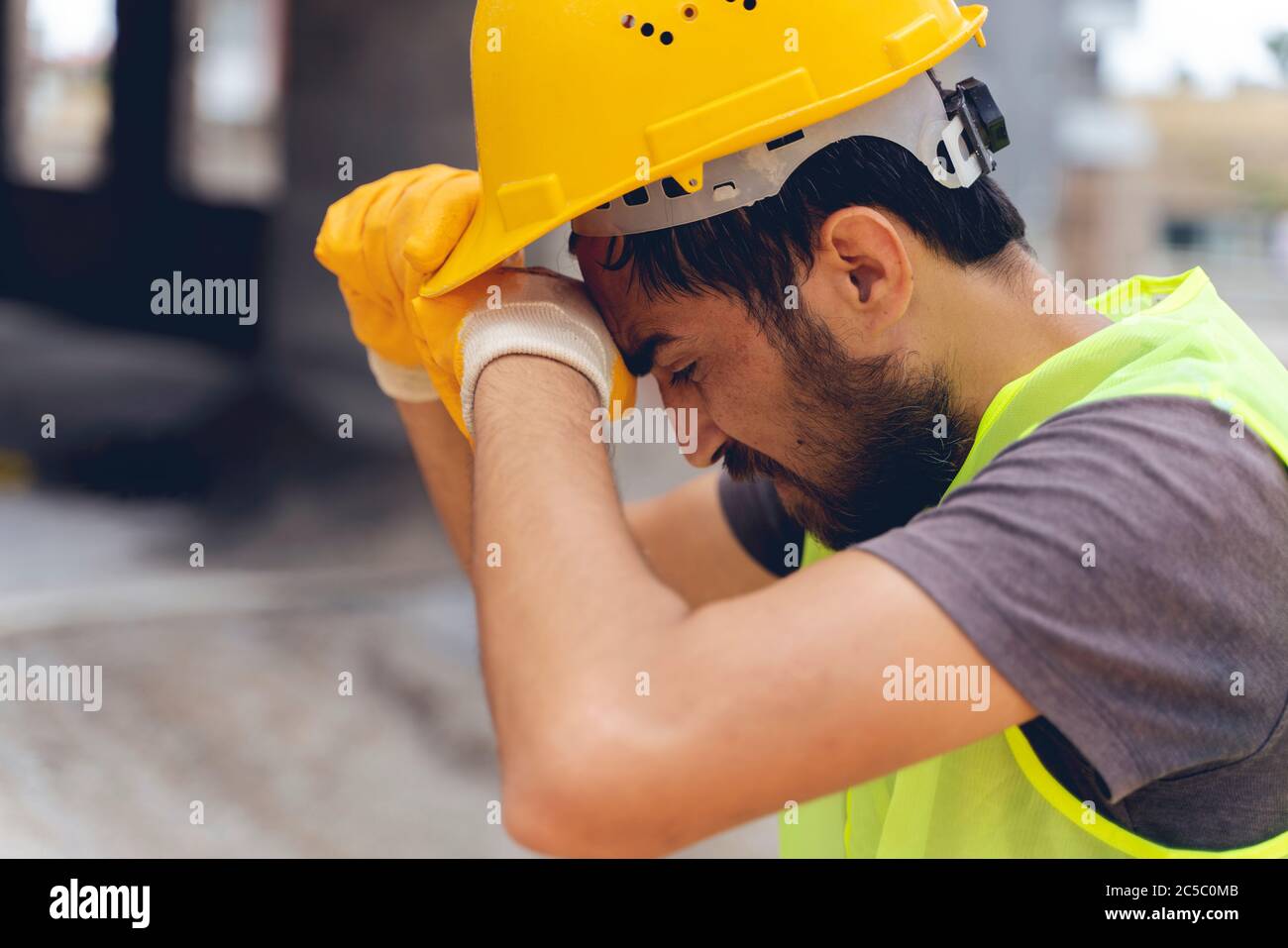 A tired construction worker wiped his head Stock Photo Alamy