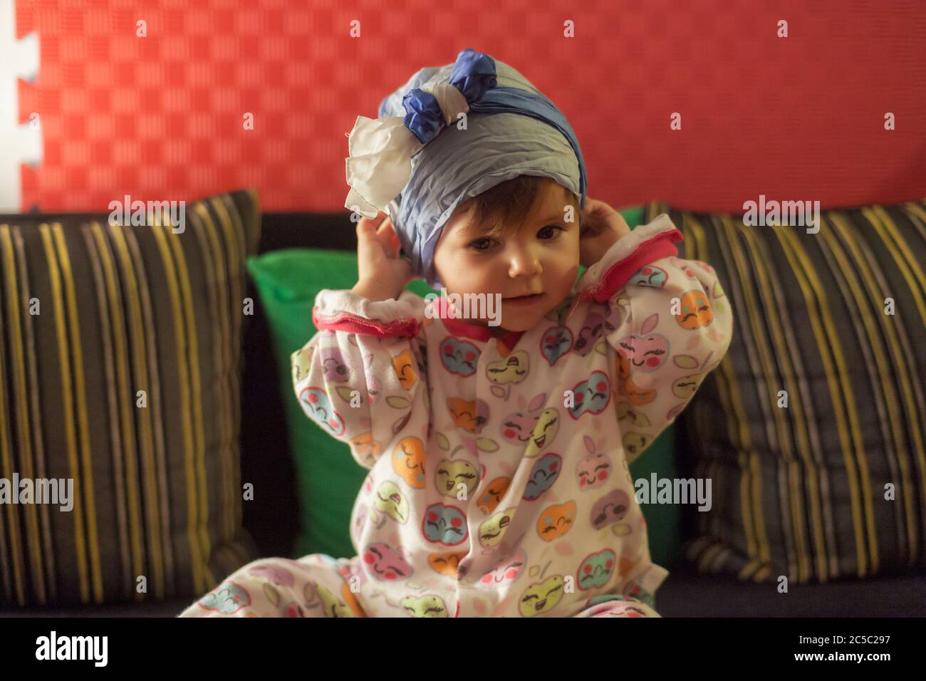 little girl posing with a scarf around her head Stock Photo Alamy
