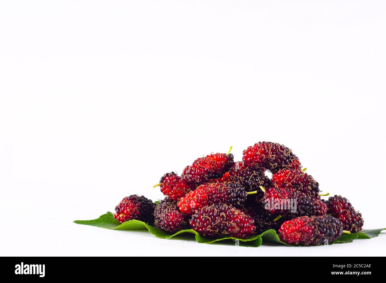 mulberries  fruit and  mulberry leaf on white background healthy mulberry fruit food isolated Stock Photo