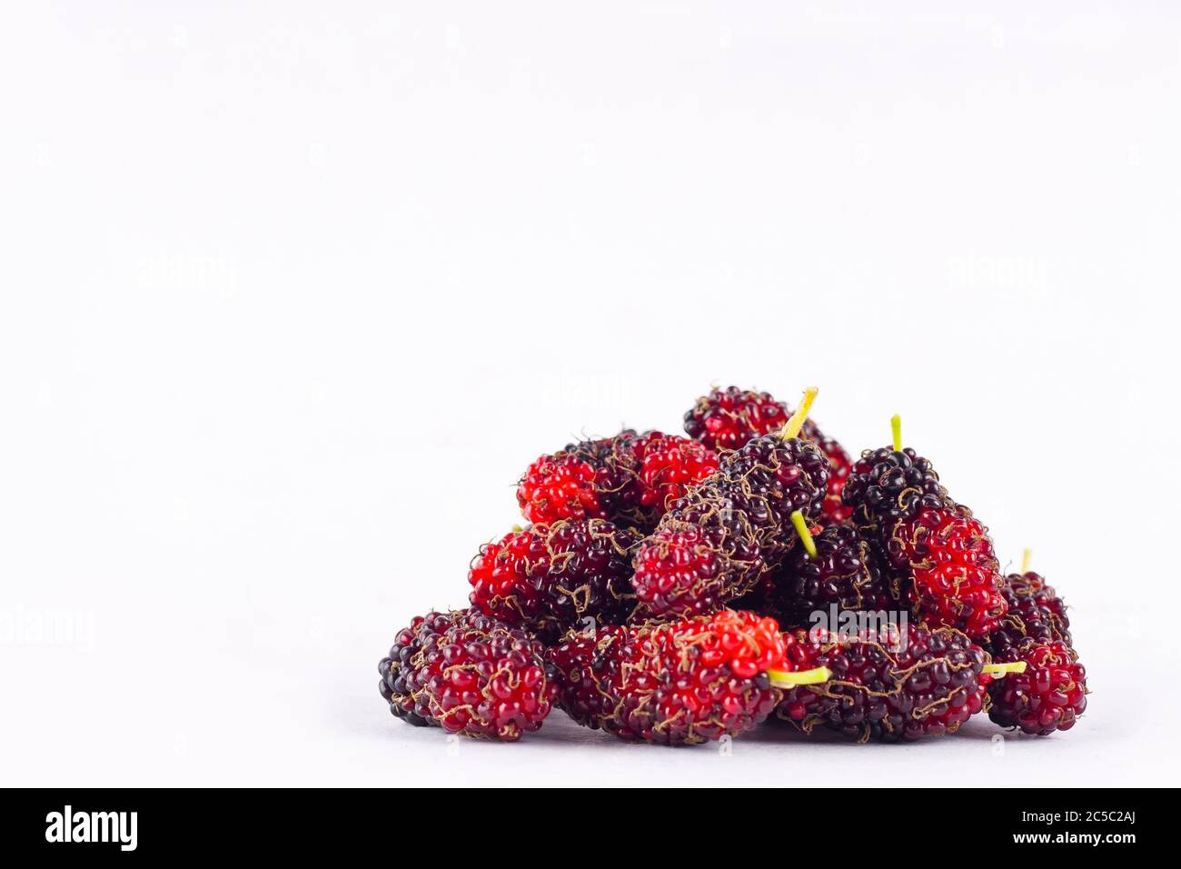 group of ripe mulberries on white background healthy mulberry fruit food isolated Stock Photo