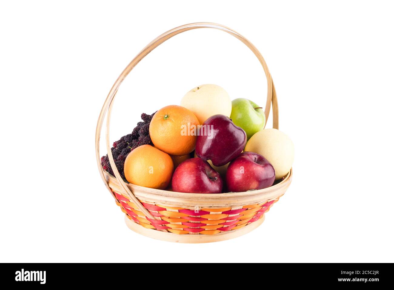 composition assorted fresh fruits such as orange, Chinese pear, mulberry, red apple and green applein  bamboo wicker basket on white background fruit Stock Photo