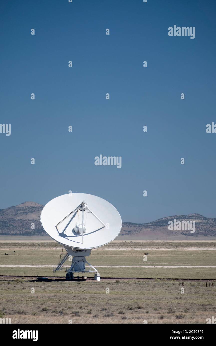 Single radio telescope with field of blue sky above Stock Photo