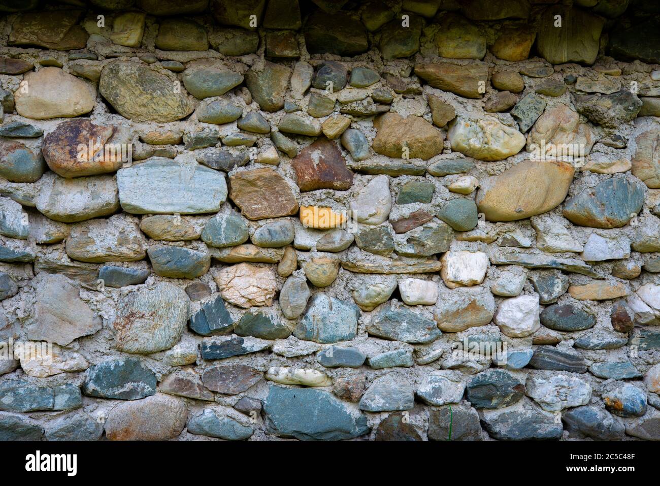 visiting the traditional house that has a stone wall Stock Photo - Alamy