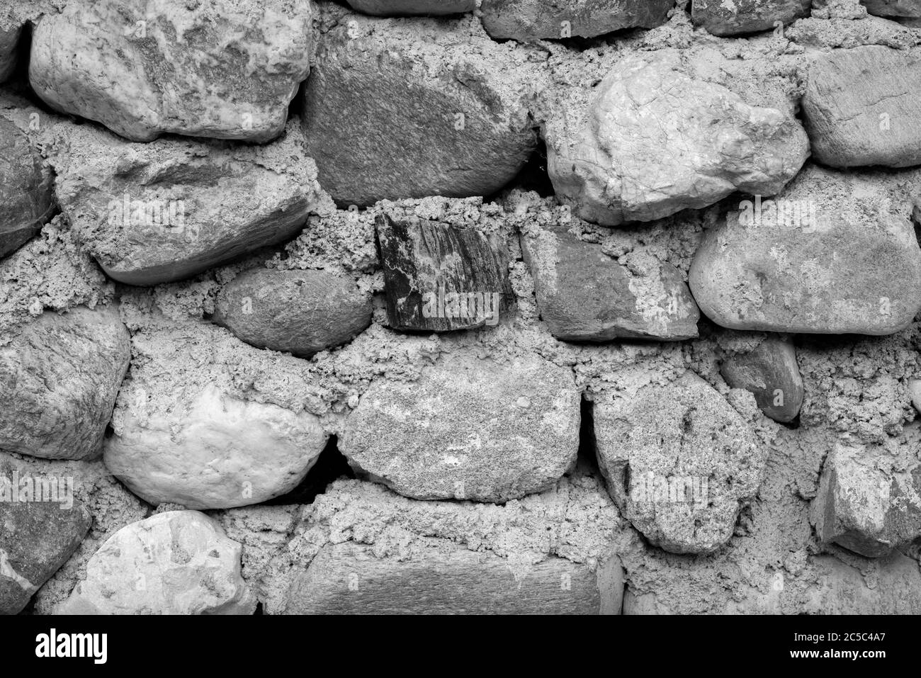 visiting the traditional house that has a stone wall Stock Photo - Alamy
