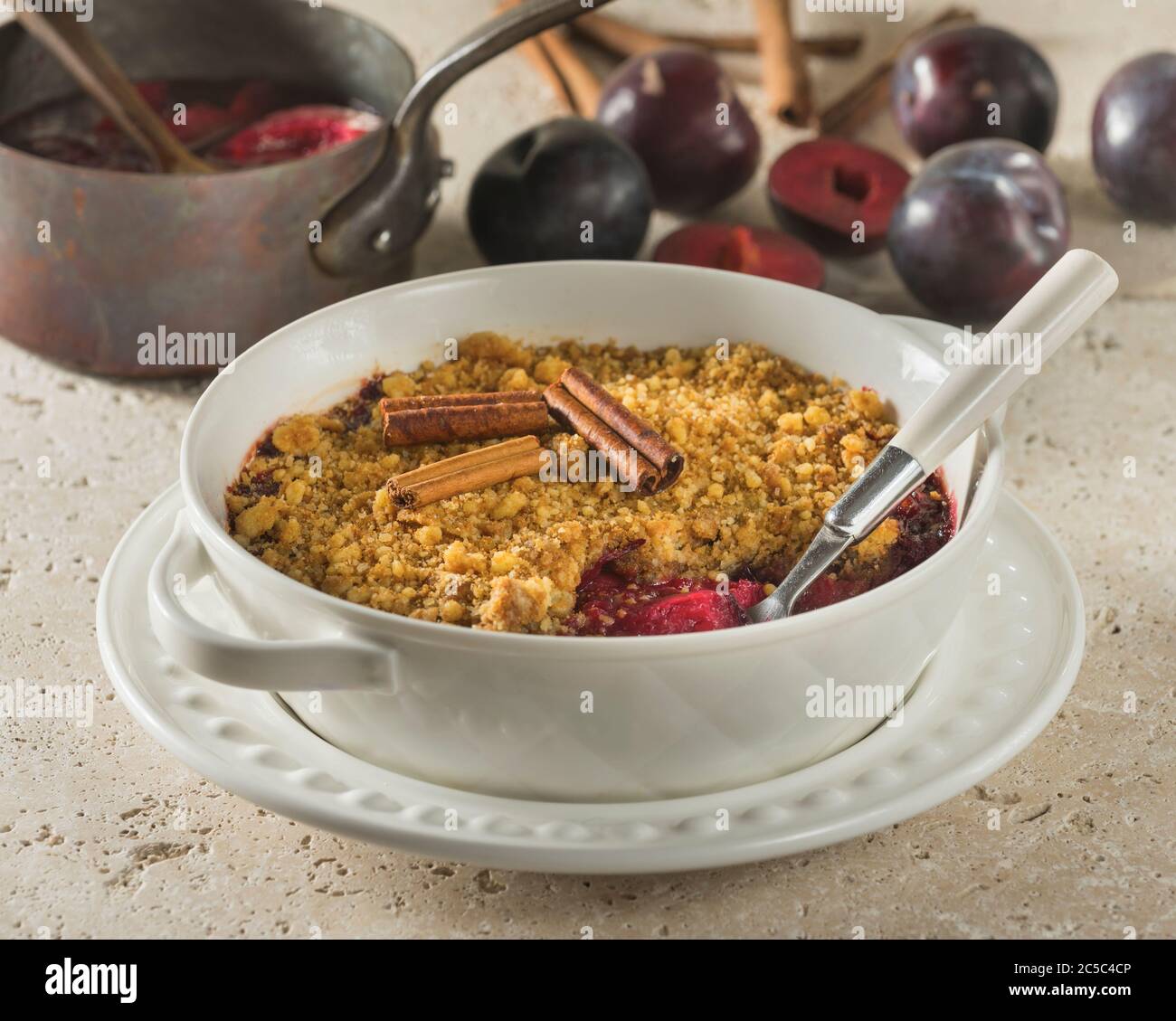 Plum crumble. Traditional British dessert. UK Food Stock Photo