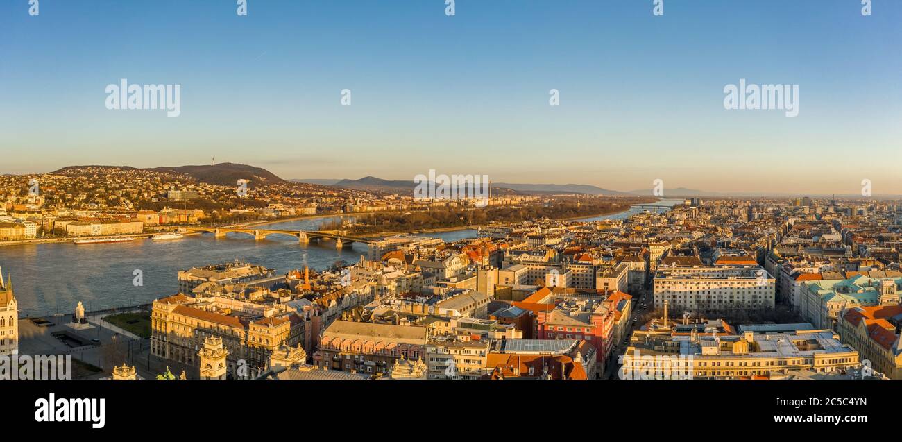 Panoramic aerial drone shot of Margaret Island in Danube river in Budapest sunrise morning glow Stock Photo