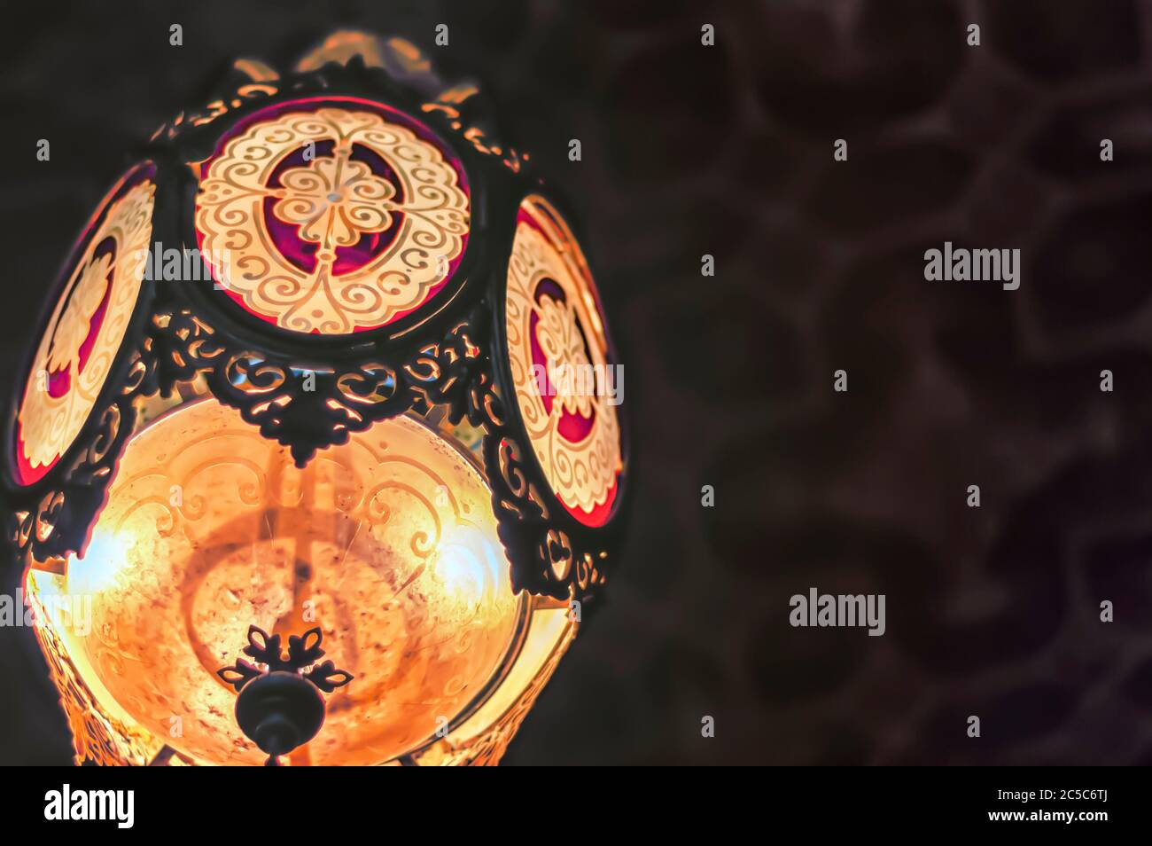 A close up of a chandelier hanging from the ceiling of Khilwat Mubarak