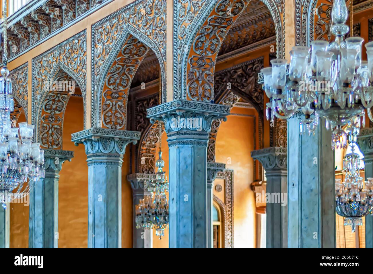 A close up of the ornate stucco work on the stone pillars at the ...