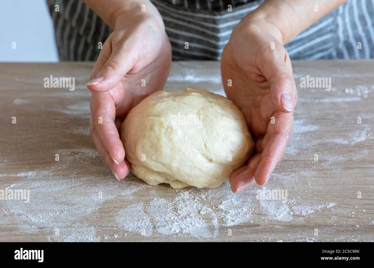 yeast dough and human arms, selective focus Stock Photo