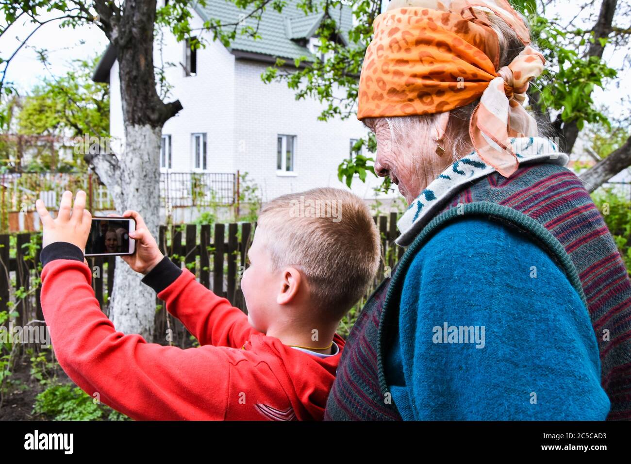 Happy grandmother and grandson taking selfie photo. concept of happy family, Video call Stock Photo