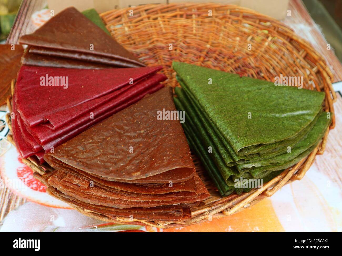 Traditional Georgian Sun-dried Pureed Fruit Sheets Called Tklapi in a  Basket Stock Photo - Alamy
