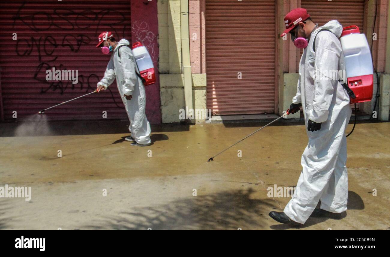 Tijuana, Mexico. 1st July, 2020. Workers sanitize a street in Tijuana, Mexico, July 1, 2020. Credit: Joebeth Terriquez/Xinhua/Alamy Live News Stock Photo