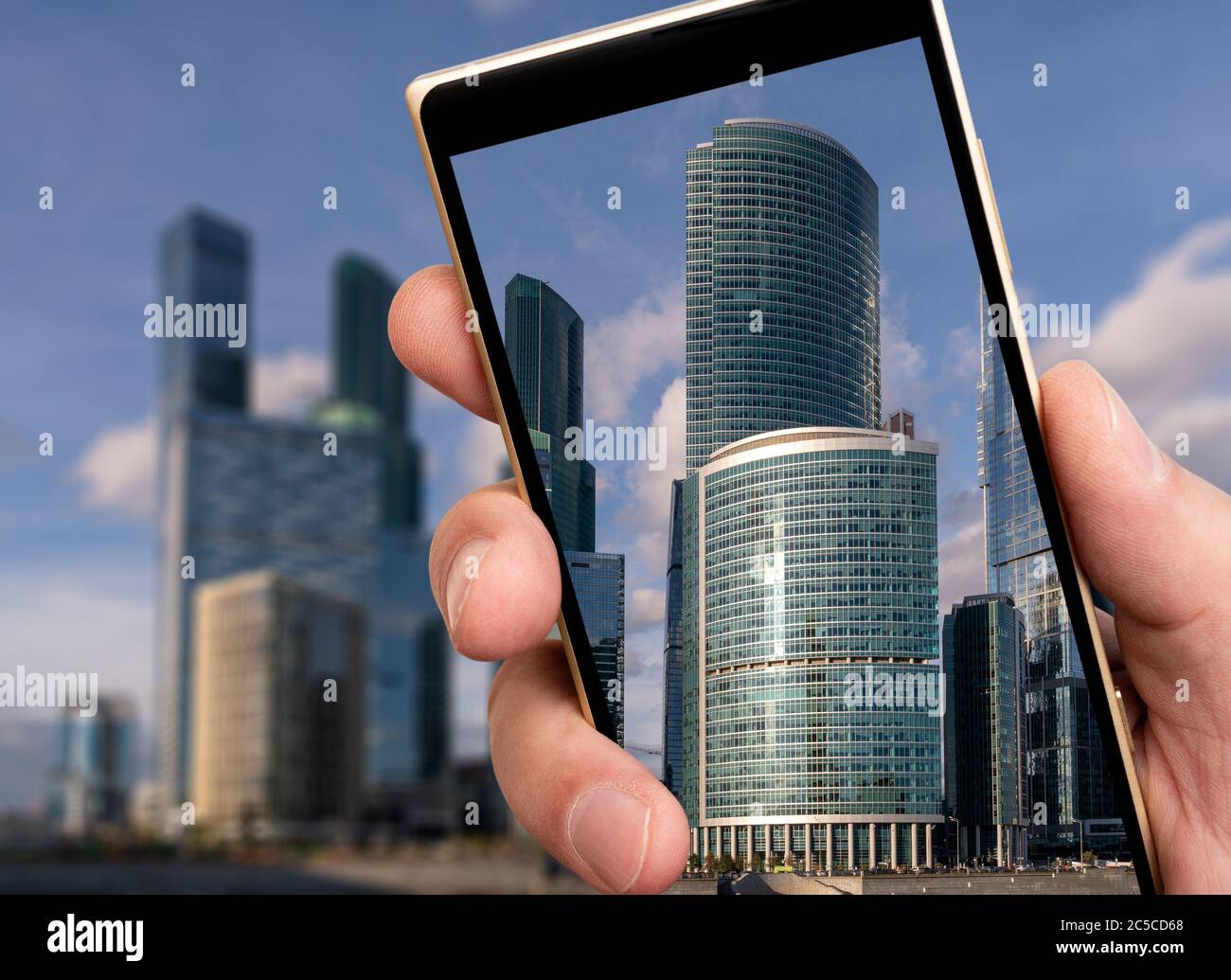 Glass skyscrapers on smartphone screen. Glass high-rise buildings in ...