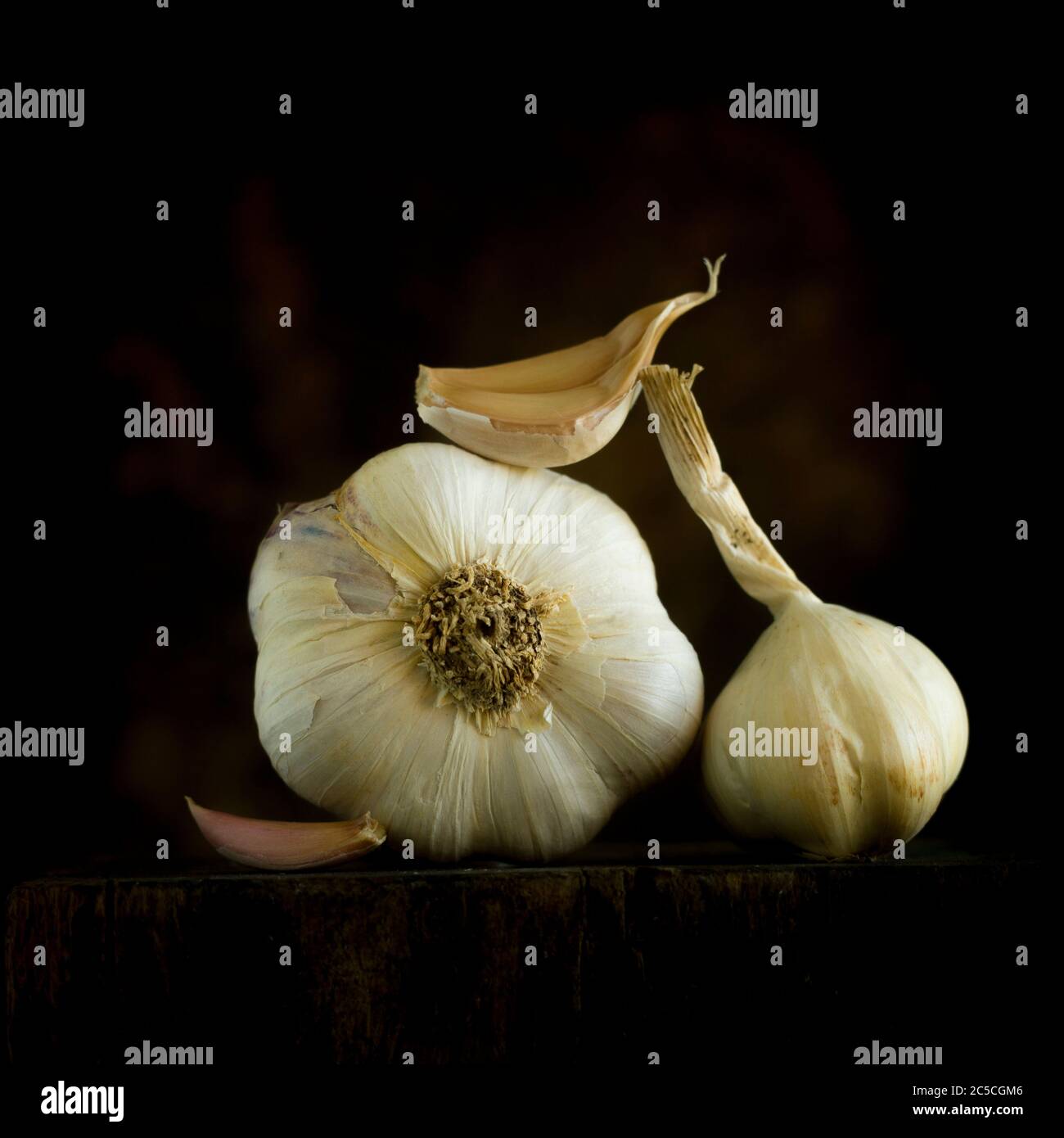 Fresh garlic on black background, studio shot Stock Photo