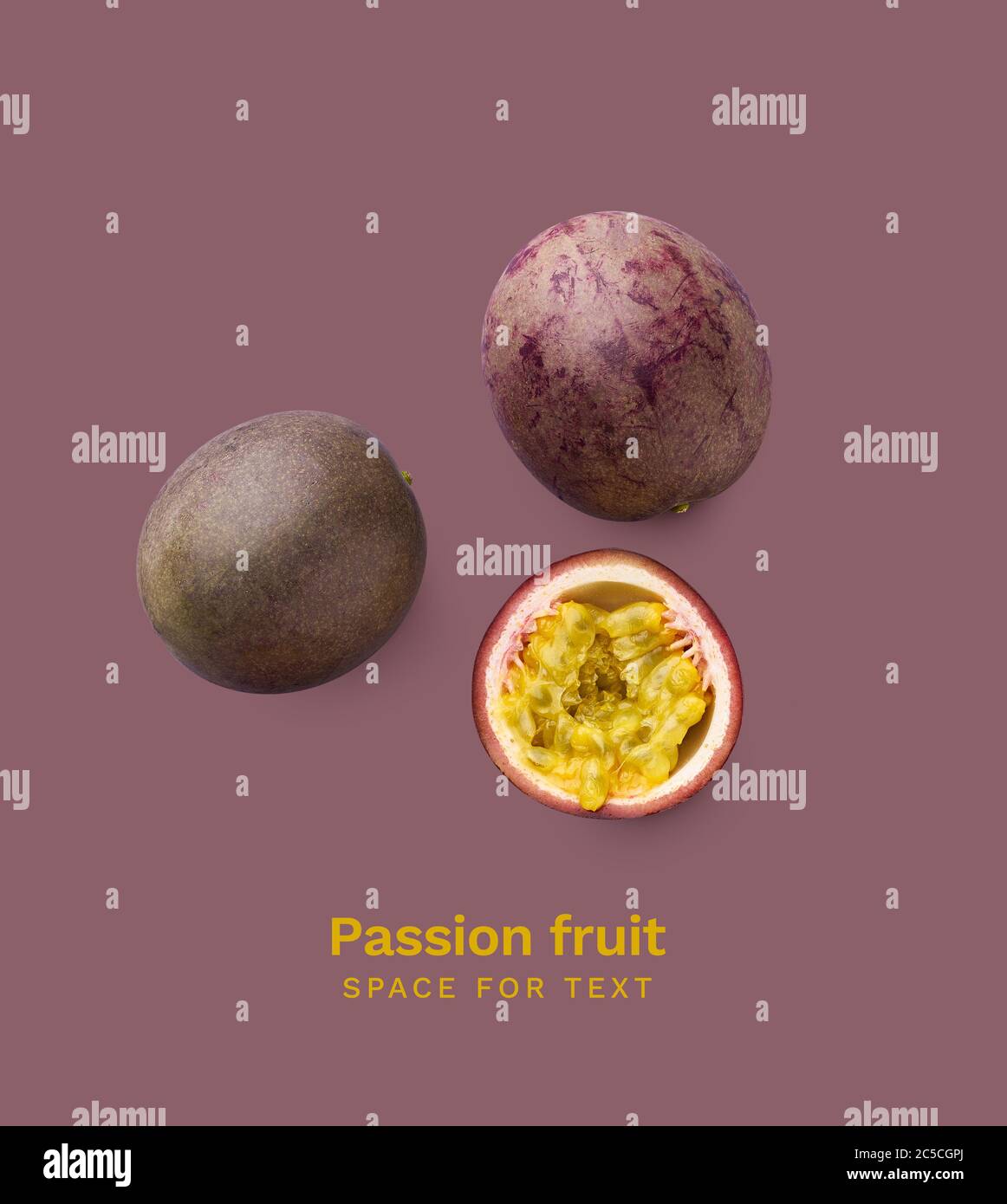 Whole and sliced passion fruit or maracuya isolated on purple background. Top view layout with copy space Stock Photo