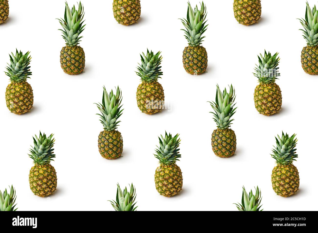 Pattern with fresh pineapples isolated on white background. Creative food concept. Stock Photo