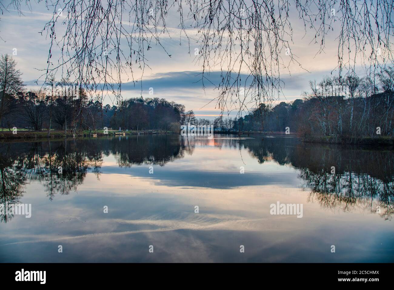 Reflections in a lake at Gundwiesen recreation area near Frankfurt airport Stock Photo