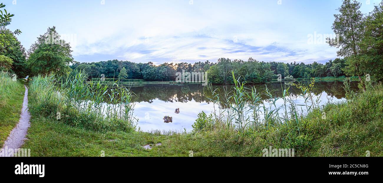 Panorama picture of lake in Gundwiesen recreation area close to Frankfurt airport Stock Photo