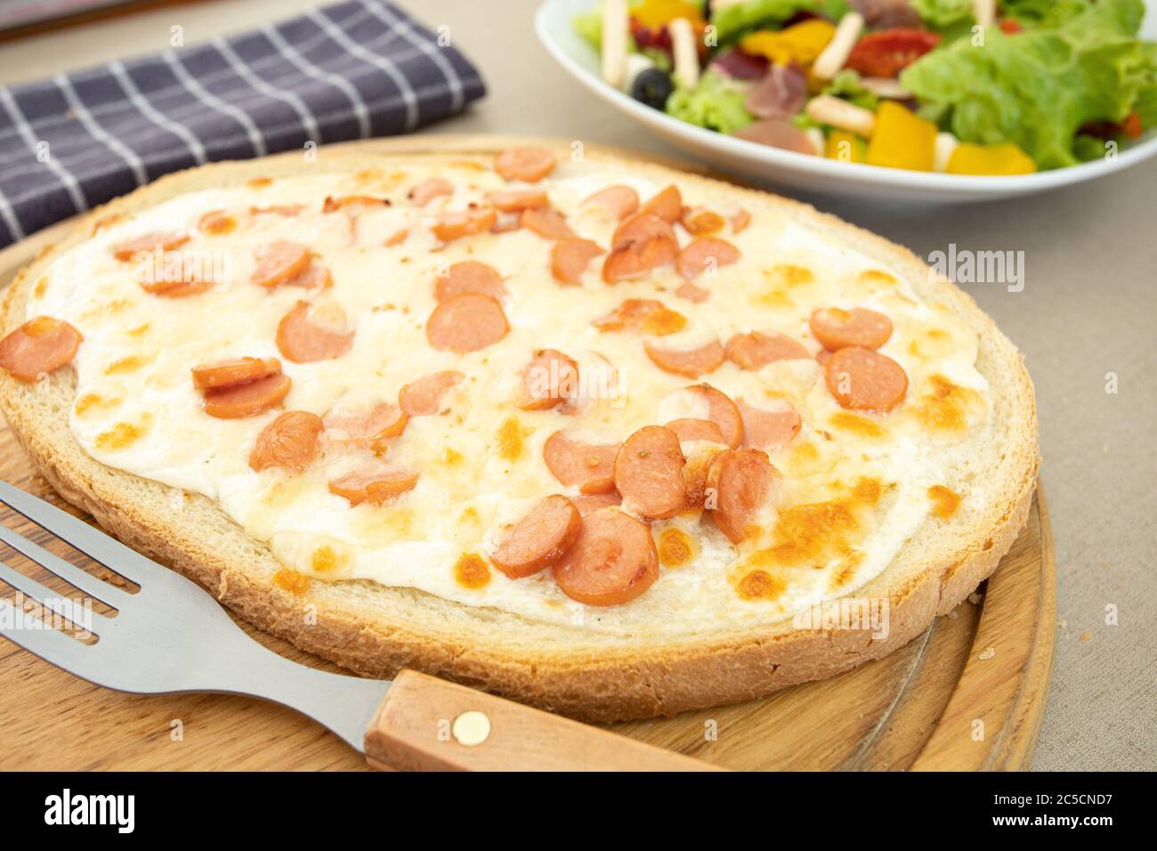 bruschetta with sausage on a table Stock Photo Alamy