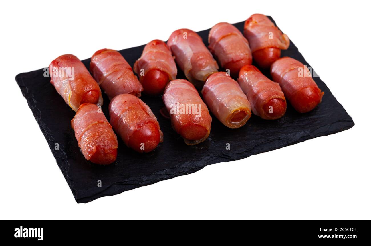 Roasted miniature sausage links wrapped in smoky bacon. Tasty appetizer