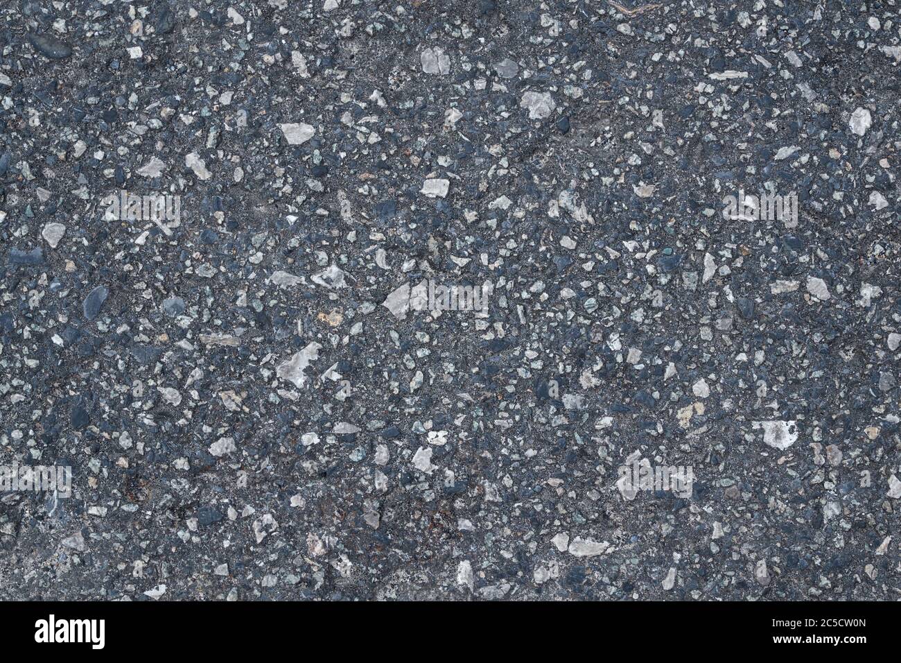 Old road made from small stones. Texture and background for your design ...