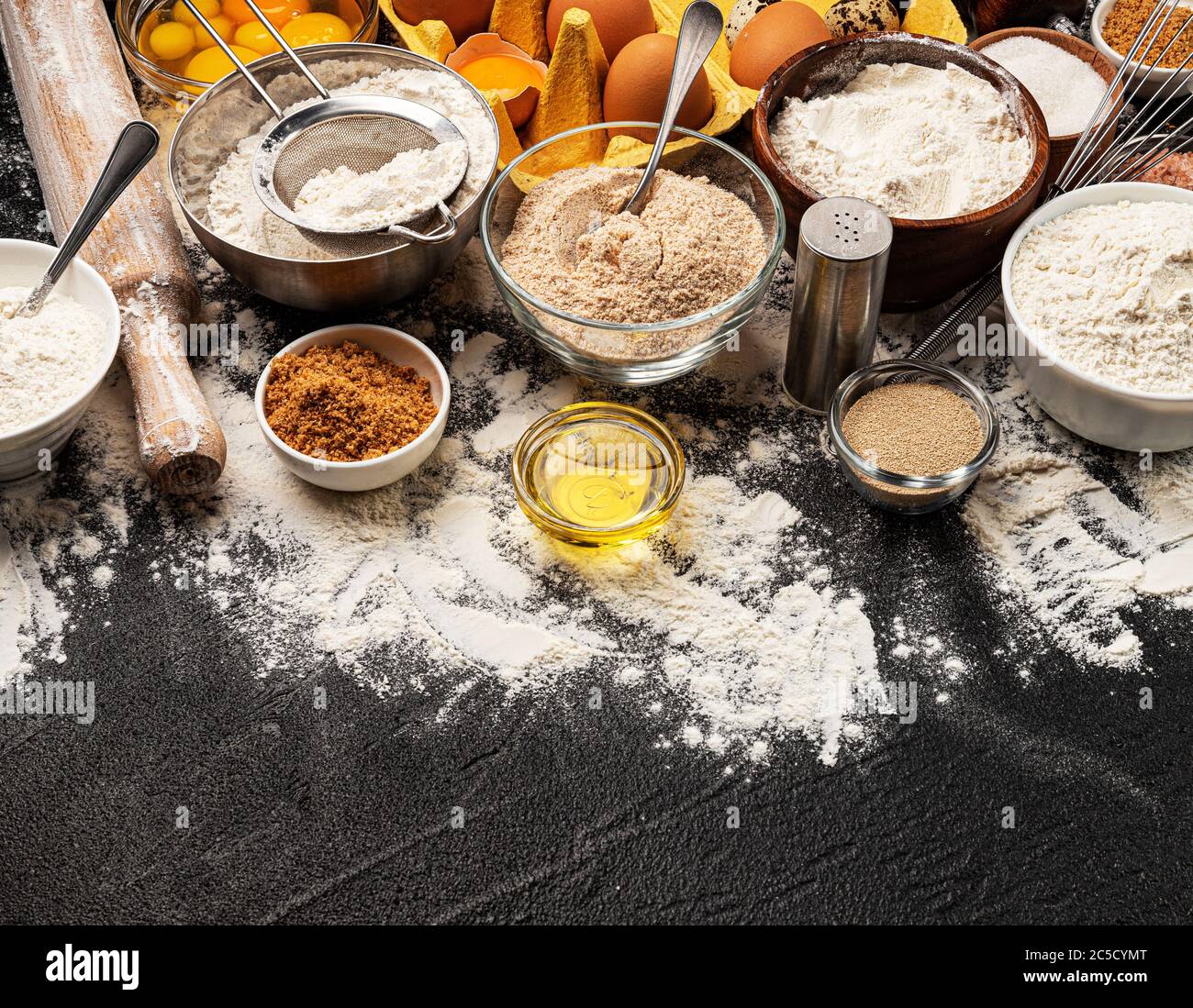 Baking ingredients on black background with copy space Stock Photo - Alamy