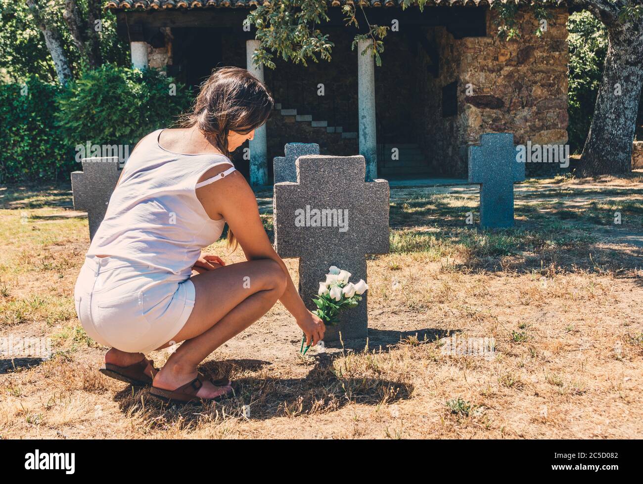Sad Girl In Cemetery Grave High Resolution Stock Photography and Images