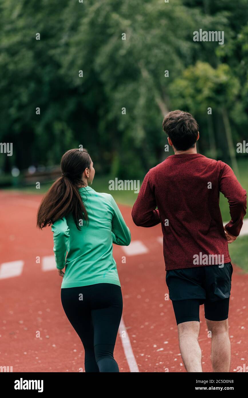 Back view sporty girl running hi-res stock photography and images - Alamy