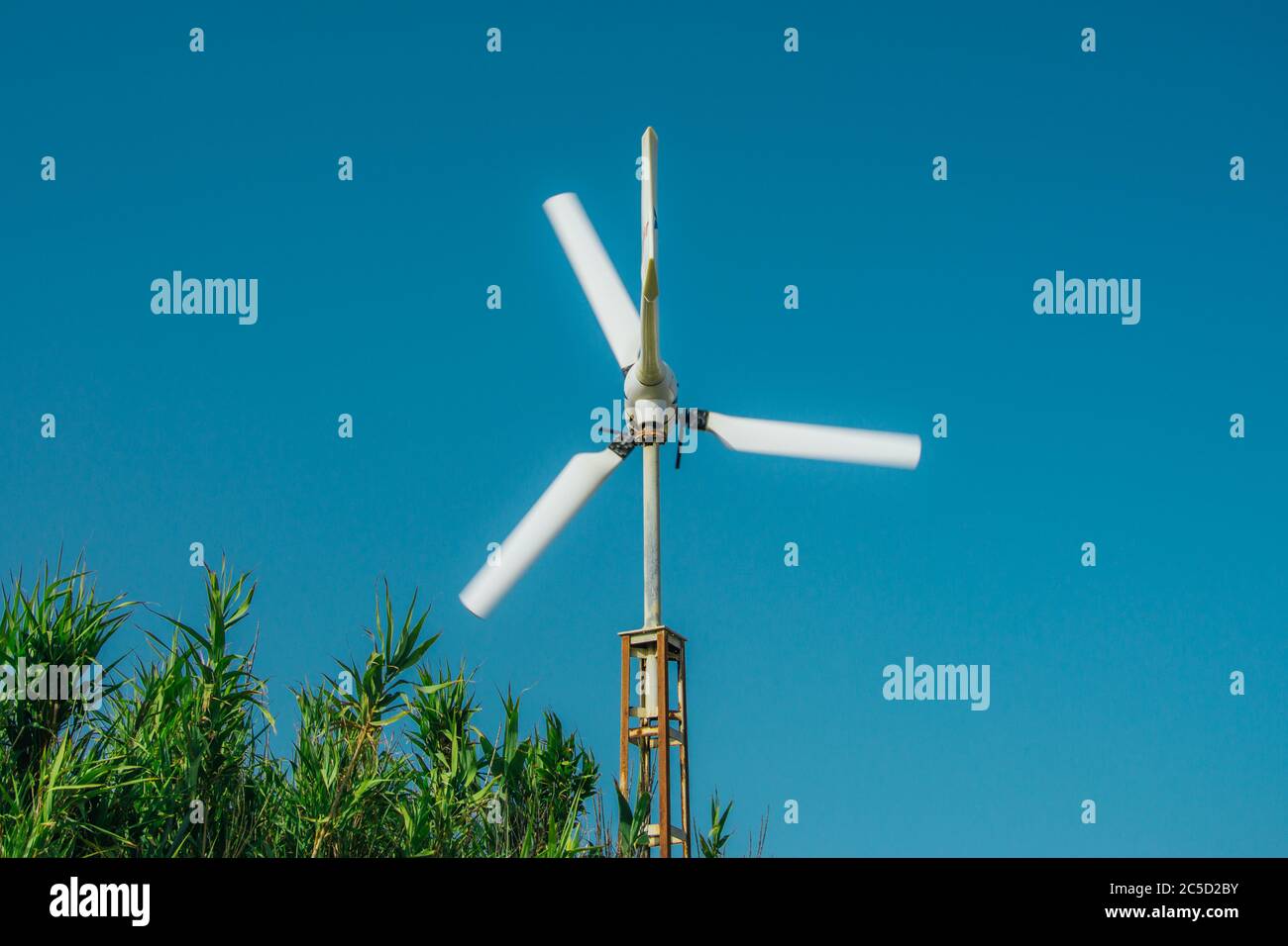 small windmill, stopping the movement of the blades with slowshutter Stock Photo