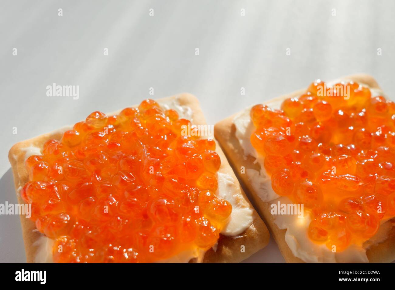 Crackers with red caviar and butter. Tasty and healthy food. Healthy