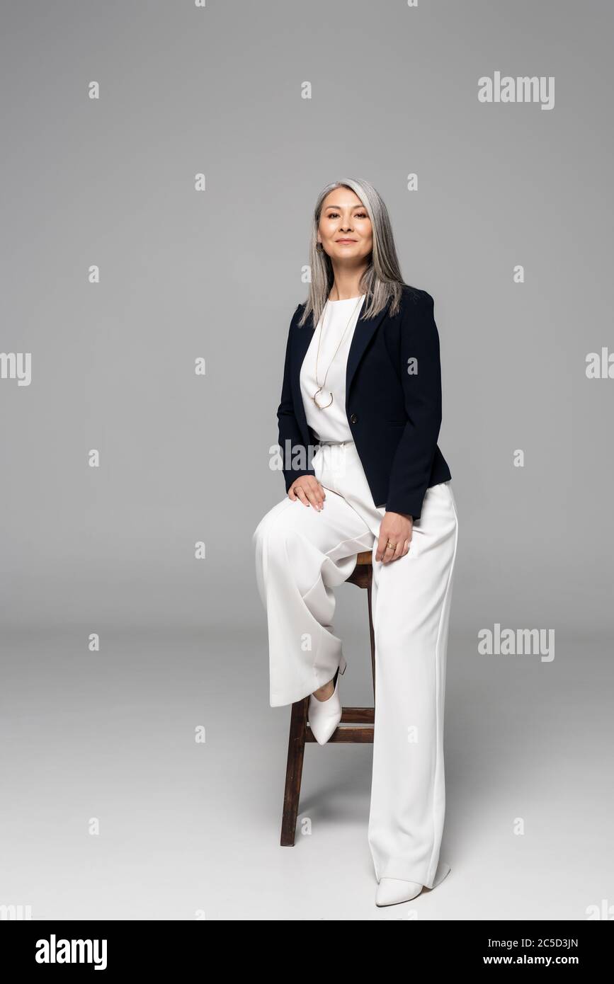 Businesswoman sitting stool hi-res stock photography and images - Alamy